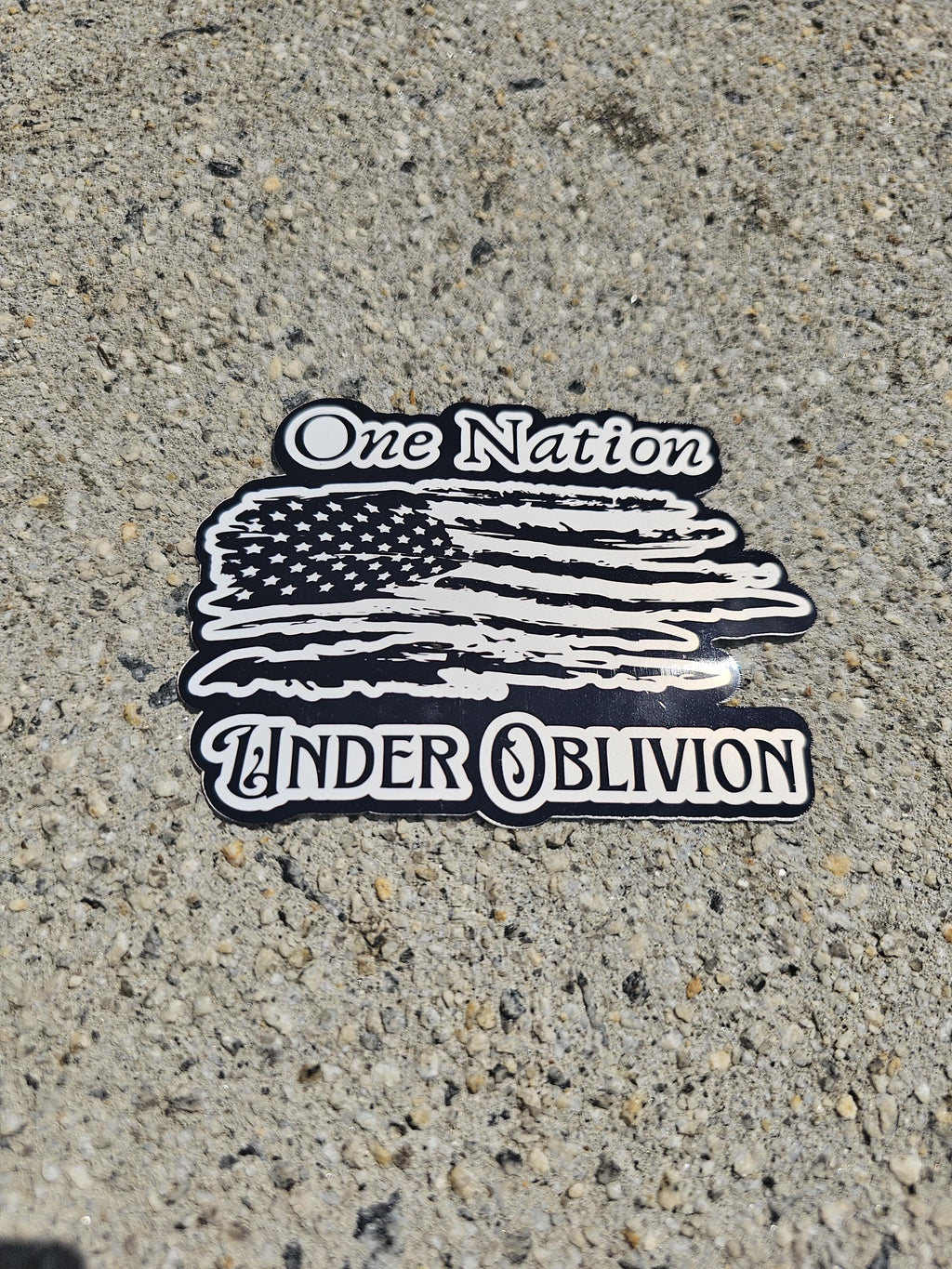 One Nation Under Oblivion - Vinyl Sticker | Tattered American Flag | Edgy Patriotism with a Dose of Reality